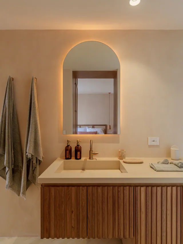Warm modern bathroom vanity at Aflora D403