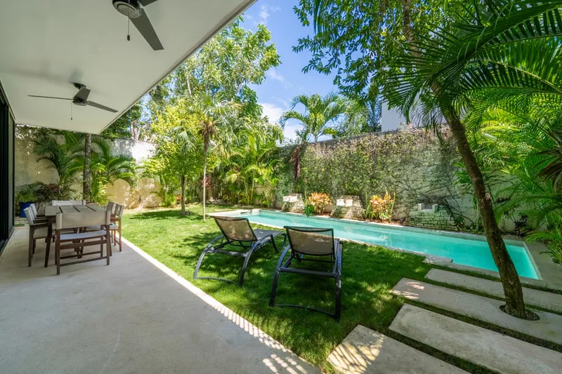 Shaded patio beside the private pool at Casa Iguana