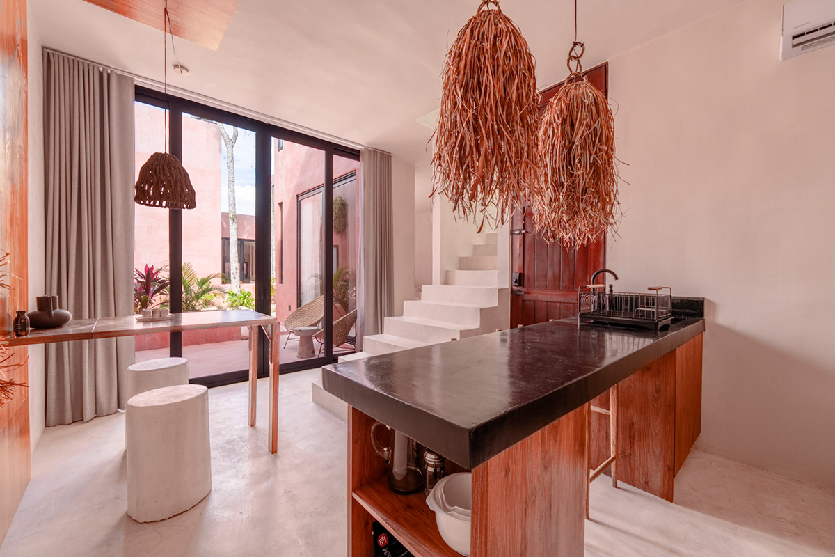 Kitchen island with wood cabinetry and woven pendant lights — Tulix 9